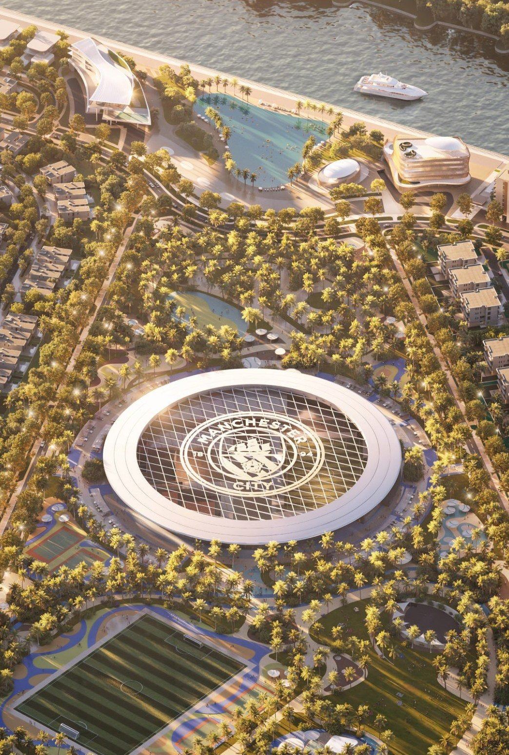 Aerial view of Manchester City Park, the football fields and the Yas Canal waterfront
